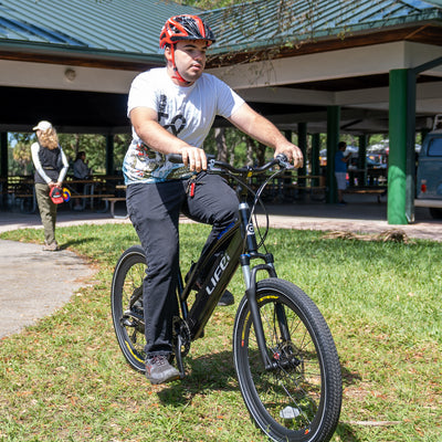 A boy is riding the Genesis R 400 ebike.