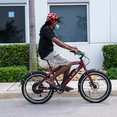 Brad's Google review of the Islander 400; picture of her with the Islander 400 ebike.